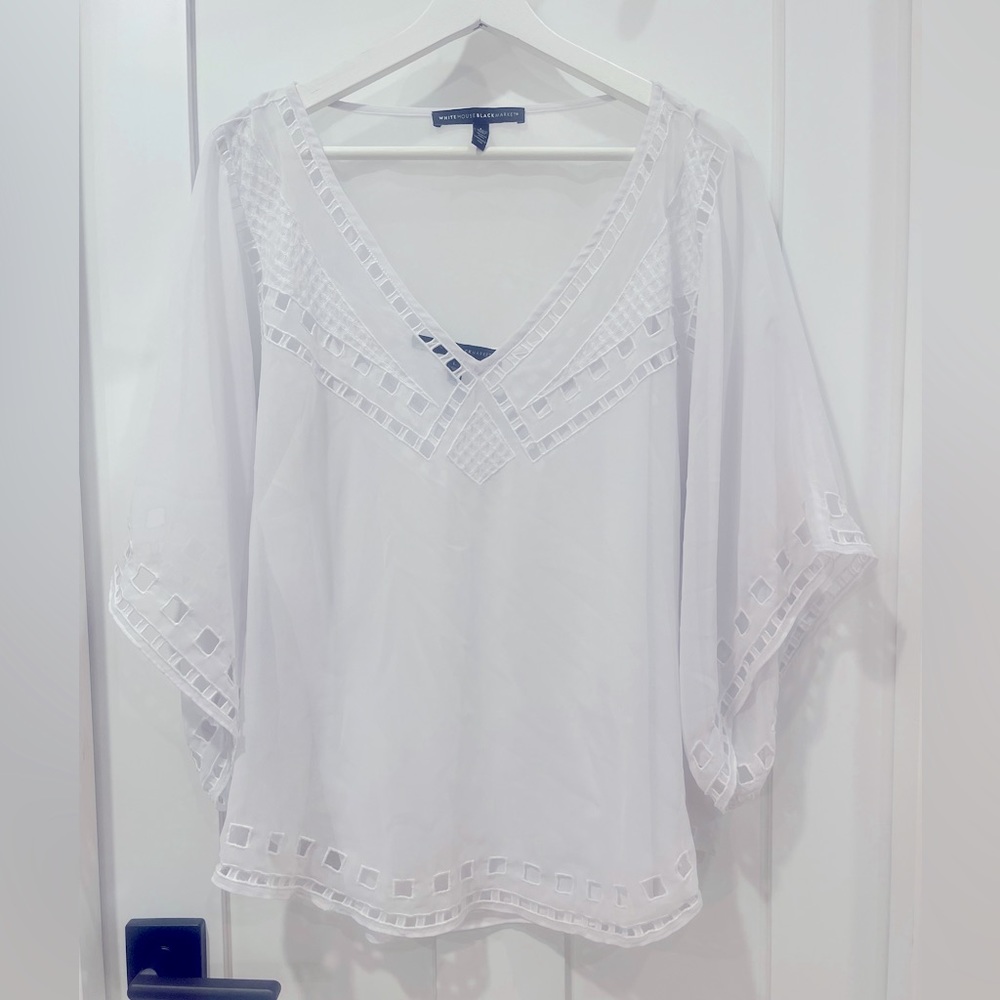 White House Black Market women’s short sleeved blouse, size Large.